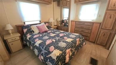 TWO BEDROOM, ONE BATHROOM MOBILE HOME IN AN ACTIVE 55+ COMMUNITY on River Run Golf Links in Florida - for sale on GolfHomes.com, golf home, golf lot