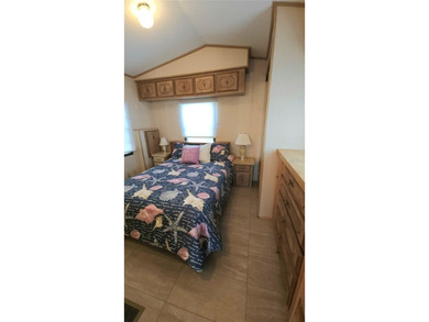 TWO BEDROOM, ONE BATHROOM MOBILE HOME IN AN ACTIVE 55+ COMMUNITY on River Run Golf Links in Florida - for sale on GolfHomes.com, golf home, golf lot