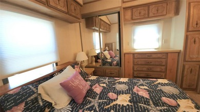 TWO BEDROOM, ONE BATHROOM MOBILE HOME IN AN ACTIVE 55+ COMMUNITY on River Run Golf Links in Florida - for sale on GolfHomes.com, golf home, golf lot