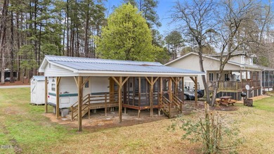 START LIVING THE LAKE LIFE NOW!! WATERFRONT GET-AWAY WITH 75 FT on River Golf and Country Club at Lake Royale in North Carolina - for sale on GolfHomes.com, golf home, golf lot