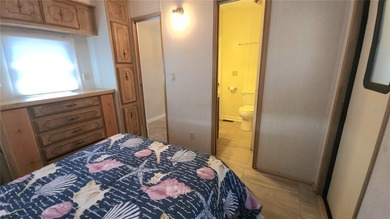 TWO BEDROOM, ONE BATHROOM MOBILE HOME IN AN ACTIVE 55+ COMMUNITY on River Run Golf Links in Florida - for sale on GolfHomes.com, golf home, golf lot