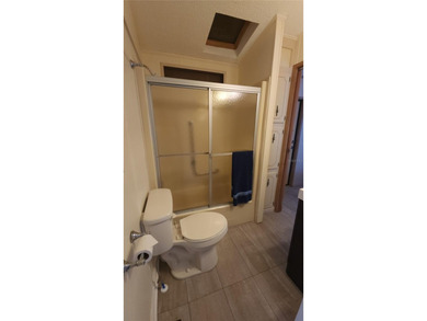 TWO BEDROOM, ONE BATHROOM MOBILE HOME IN AN ACTIVE 55+ COMMUNITY on River Run Golf Links in Florida - for sale on GolfHomes.com, golf home, golf lot