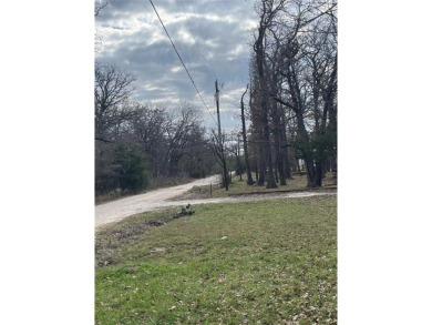 Already in place, 1200+- square foot metal workshop with a slab on Tawakoni Golf Course in Texas - for sale on GolfHomes.com, golf home, golf lot