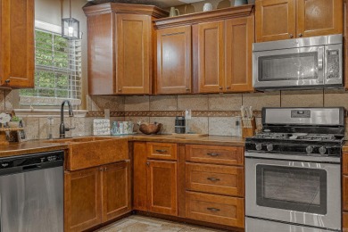 Discover refined living in this stunning 4-bedroom, 3-bath home on The Course At Eagle Mountain in Arkansas - for sale on GolfHomes.com, golf home, golf lot