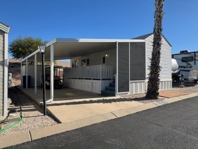 This home is in a 55+ age qualified resort community. This on Voyager RV Resort and Golf Course in Arizona - for sale on GolfHomes.com, golf home, golf lot