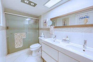 Experience turnkey luxury in this completely redesigned on Palm-Aire Country Club and Resort - The Oaks in Florida - for sale on GolfHomes.com, golf home, golf lot