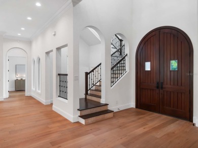 One or more photo(s) has been virtually staged. Nestled along on Lake Nona Golf Club, Inc. in Florida - for sale on GolfHomes.com, golf home, golf lot