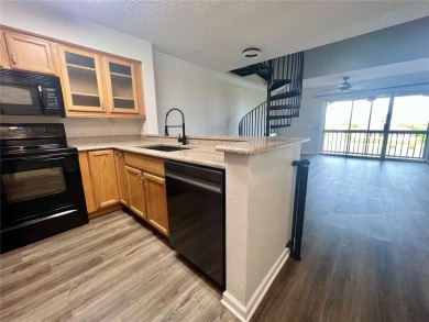 HIGH  DRY 2BR/1BA 3RD FLOOR Condo with detached garage and on Feather Sound Country Club in Florida - for sale on GolfHomes.com, golf home, golf lot