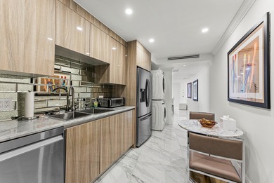 Experience coastal living at its finest in this fully updated on Palm Beach Par-3 Golf Course in Florida - for sale on GolfHomes.com, golf home, golf lot