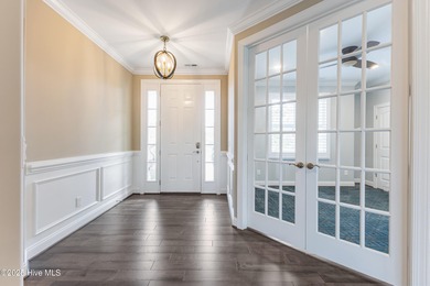 Welcome to this stunning 3-bedroom, 2.5-bathroom home in the on Cape Fear National At Brunswick Forest in North Carolina - for sale on GolfHomes.com, golf home, golf lot