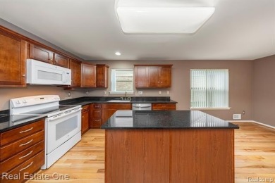 Enjoy an easier lifestyle in this newer detached cape cod condo on Whispering Willows Golf Course in Michigan - for sale on GolfHomes.com, golf home, golf lot