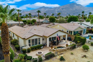 Perched on an elevated 7,841 sq. ft. lot overlooking the 9th on Golf Club At La Quinta in California - for sale on GolfHomes.com, golf home, golf lot