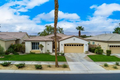 Perched on an elevated 7,841 sq. ft. lot overlooking the 9th on Golf Club At La Quinta in California - for sale on GolfHomes.com, golf home, golf lot