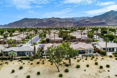 Perched on an elevated 7,841 sq. ft. lot overlooking the 9th on Golf Club At La Quinta in California - for sale on GolfHomes.com, golf home, golf lot