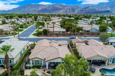 Perched on an elevated 7,841 sq. ft. lot overlooking the 9th on Golf Club At La Quinta in California - for sale on GolfHomes.com, golf home, golf lot