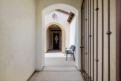 Perched on an elevated 7,841 sq. ft. lot overlooking the 9th on Golf Club At La Quinta in California - for sale on GolfHomes.com, golf home, golf lot
