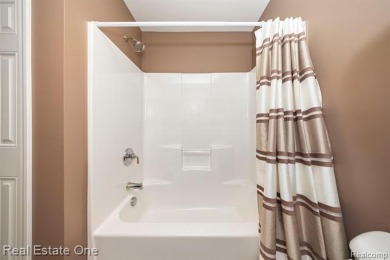 Enjoy an easier lifestyle in this newer detached cape cod condo on Whispering Willows Golf Course in Michigan - for sale on GolfHomes.com, golf home, golf lot