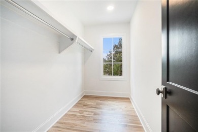 Set on a sprawling 1-acre lot in an established, tree-lined on Dunwoody Country Club in Georgia - for sale on GolfHomes.com, golf home, golf lot