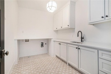 Set on a sprawling 1-acre lot in an established, tree-lined on Dunwoody Country Club in Georgia - for sale on GolfHomes.com, golf home, golf lot