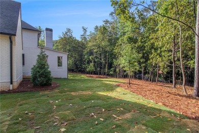 Set on a sprawling 1-acre lot in an established, tree-lined on Dunwoody Country Club in Georgia - for sale on GolfHomes.com, golf home, golf lot