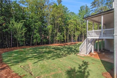 Set on a sprawling 1-acre lot in an established, tree-lined on Dunwoody Country Club in Georgia - for sale on GolfHomes.com, golf home, golf lot