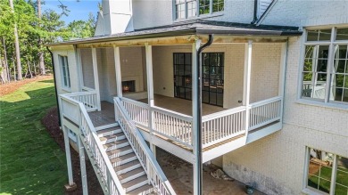 Set on a sprawling 1-acre lot in an established, tree-lined on Dunwoody Country Club in Georgia - for sale on GolfHomes.com, golf home, golf lot