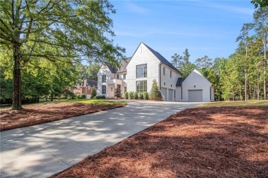 Set on a sprawling 1-acre lot in an established, tree-lined on Dunwoody Country Club in Georgia - for sale on GolfHomes.com, golf home, golf lot