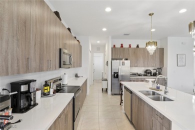 Discover luxury living with scenic golf course views and no rear on Panther Run Golf Club in Florida - for sale on GolfHomes.com, golf home, golf lot