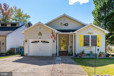 Welcome to this stunning single-level waterfront rancher in on Ocean Pines Golf and Country Club in Maryland - for sale on GolfHomes.com, golf home, golf lot