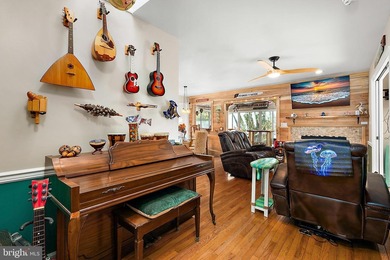 Welcome to this stunning single-level waterfront rancher in on Ocean Pines Golf and Country Club in Maryland - for sale on GolfHomes.com, golf home, golf lot