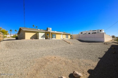 Don't miss the opportunity to own this charming and cozy home on London Bridge Golf Course in Arizona - for sale on GolfHomes.com, golf home, golf lot