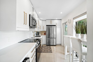 Beautifully updated 2nd-floor residence featuring bold color on Quail Ridge Golf Course and Country Club in Florida - for sale on GolfHomes.com, golf home, golf lot