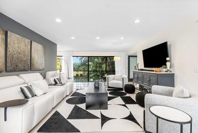 Beautifully updated 2nd-floor residence featuring bold color on Quail Ridge Golf Course and Country Club in Florida - for sale on GolfHomes.com, golf home, golf lot