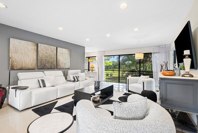 Beautifully updated 2nd-floor residence featuring bold color on Quail Ridge Golf Course and Country Club in Florida - for sale on GolfHomes.com, golf home, golf lot