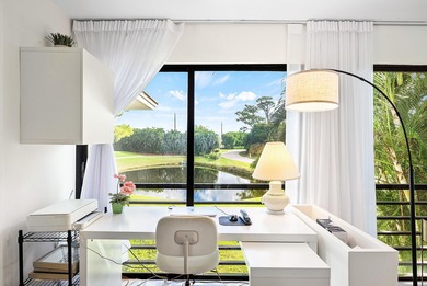 Beautifully updated 2nd-floor residence featuring bold color on Quail Ridge Golf Course and Country Club in Florida - for sale on GolfHomes.com, golf home, golf lot