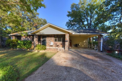 This charming partial lakeview home offers an inviting retreat on Mountain Ranch Golf Club in Arkansas - for sale on GolfHomes.com, golf home, golf lot