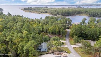 Tucked among the trees in the waterfront community of Fairfield on Harbour Point Golf Club in North Carolina - for sale on GolfHomes.com, golf home, golf lot