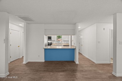 Tucked among the trees in the waterfront community of Fairfield on Harbour Point Golf Club in North Carolina - for sale on GolfHomes.com, golf home, golf lot