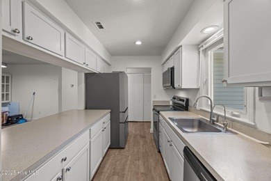 Tucked among the trees in the waterfront community of Fairfield on Harbour Point Golf Club in North Carolina - for sale on GolfHomes.com, golf home, golf lot