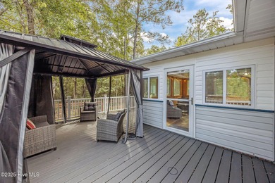 Tucked among the trees in the waterfront community of Fairfield on Harbour Point Golf Club in North Carolina - for sale on GolfHomes.com, golf home, golf lot