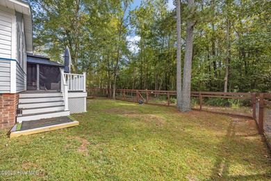 Tucked among the trees in the waterfront community of Fairfield on Harbour Point Golf Club in North Carolina - for sale on GolfHomes.com, golf home, golf lot