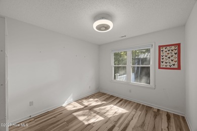 Tucked among the trees in the waterfront community of Fairfield on Harbour Point Golf Club in North Carolina - for sale on GolfHomes.com, golf home, golf lot