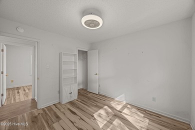 Tucked among the trees in the waterfront community of Fairfield on Harbour Point Golf Club in North Carolina - for sale on GolfHomes.com, golf home, golf lot