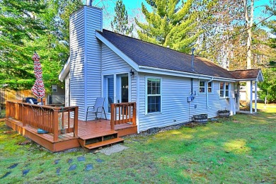 Step into rustic charm with this almost all-knotty pine interior on Birch Pointe Golf Club in Michigan - for sale on GolfHomes.com, golf home, golf lot