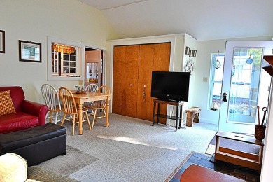 Step into rustic charm with this almost all-knotty pine interior on Birch Pointe Golf Club in Michigan - for sale on GolfHomes.com, golf home, golf lot