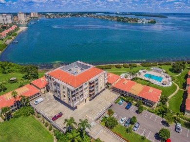 Welcome to the epitome of waterfront living at this impeccably on Isla Del Sol Yacht and Country Club in Florida - for sale on GolfHomes.com, golf home, golf lot