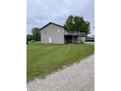 Don't miss this spacious 2,520 sq ft home located on 2.89 acres on The Pines Golf Course at Lake Isabella in Michigan - for sale on GolfHomes.com, golf home, golf lot