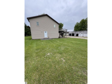 Don't miss this spacious 2,520 sq ft home located on 2.89 acres on The Pines Golf Course at Lake Isabella in Michigan - for sale on GolfHomes.com, golf home, golf lot