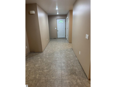 Don't miss this spacious 2,520 sq ft home located on 2.89 acres on The Pines Golf Course at Lake Isabella in Michigan - for sale on GolfHomes.com, golf home, golf lot