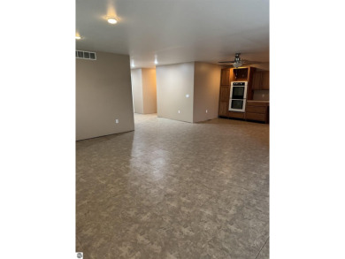 Don't miss this spacious 2,520 sq ft home located on 2.89 acres on The Pines Golf Course at Lake Isabella in Michigan - for sale on GolfHomes.com, golf home, golf lot